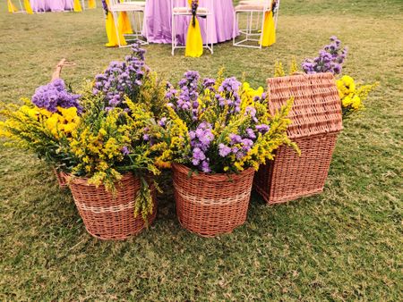 small intimate wedding decor with cane basket and florals