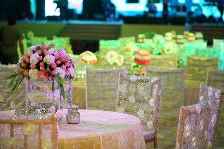 Photo of White Floral Seating with Floral Centerpiece