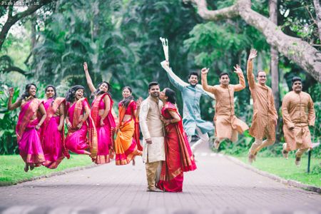 Photo of south indian fun bridesmaids and grooms men portrait