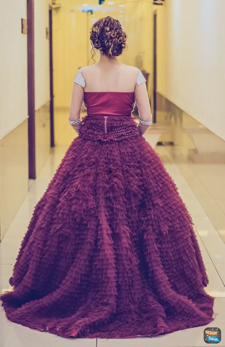 Deep wine colored ruffled gown on bride