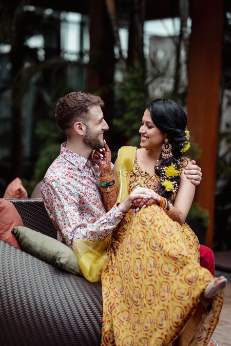 Candid shot of a happy couple from their Mehndi
