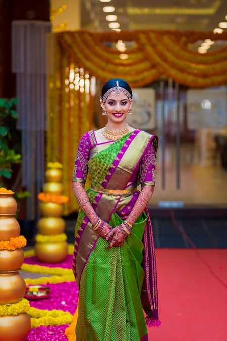A south Indian bride in a gorgeous green saree