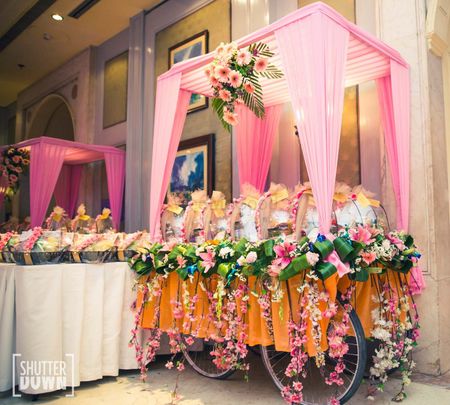 Photo of A hand cart decorated with flowers to make unique wedding prop.