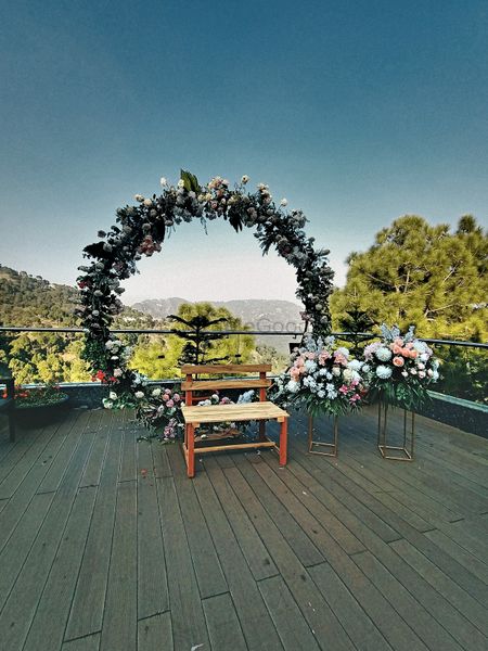 Photo of Floral wreath for haldi on a terrace.
