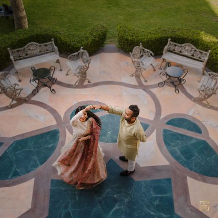 A beautiful shot of the couple caught dancing and twirling. 