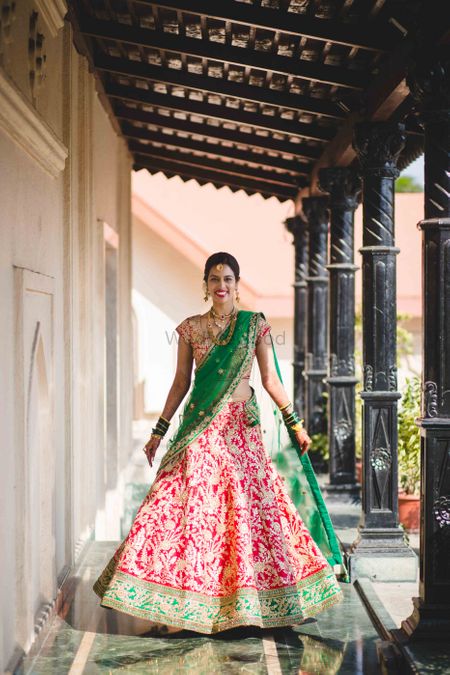 Photo of Bright Red and Emerald Green Lehenga