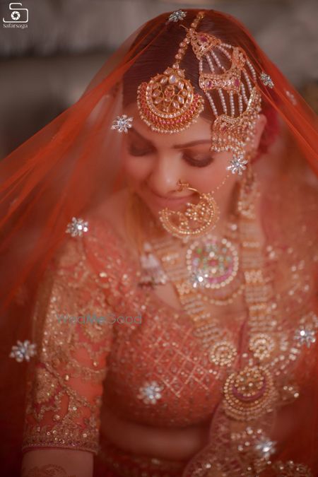 Photo of Getting ready shot of a bride wearing a veil.