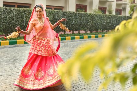 Photo of Hot Pink Shaded Twirling Lehenga with Gold Work
