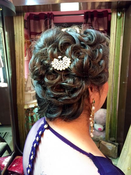 Bun with tied up curls for sangeet or engagement