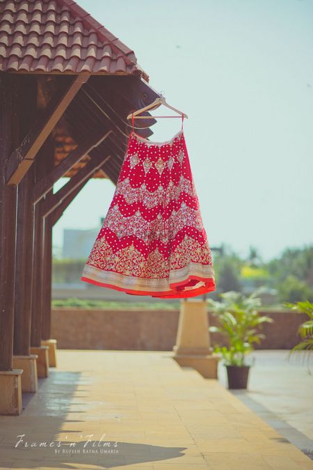 Red Lehenga with Silver Motifs on a Hanger