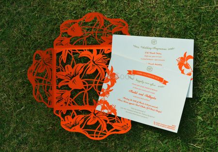 Photo of red laser cut invites