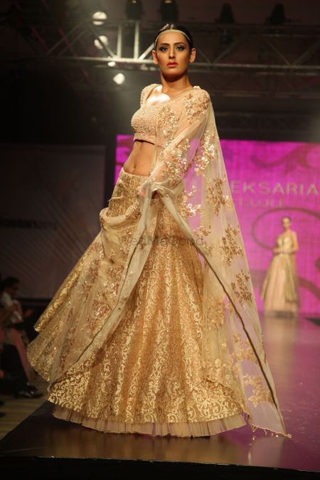 Photo of Pastel Pink and Gold Shimmer Lehenga with Net Dupatta