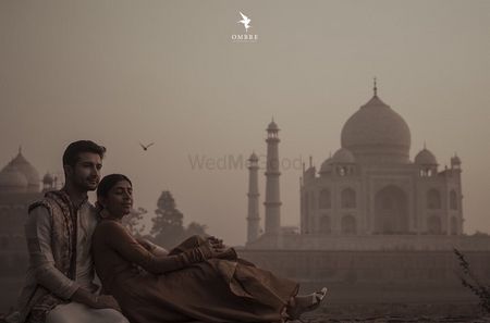 A pre-wedding shoot of the couple with the Taj Mahal in the background