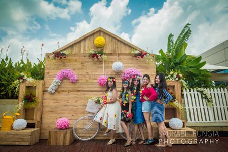 Fun photobooth backdrop with bridesmaids