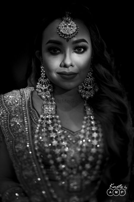 Black and white bridal portrait with layered jewellery