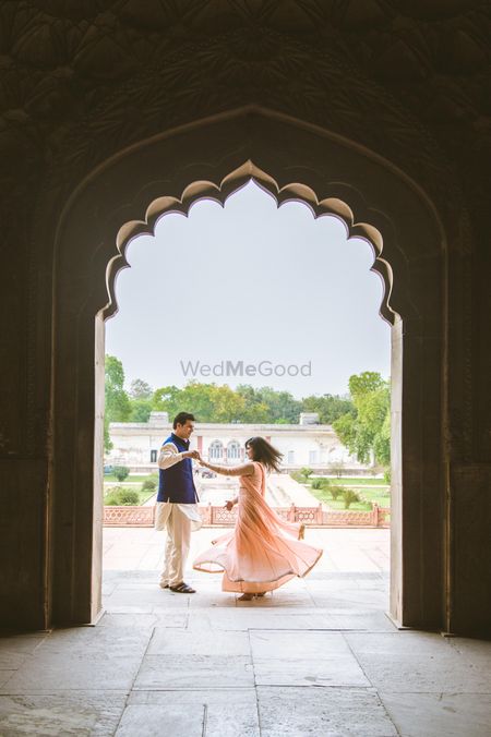 Photo of bride twirling pre wedding shoot in fort