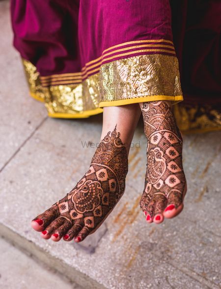Shot of minimal bridal feet mehndi design