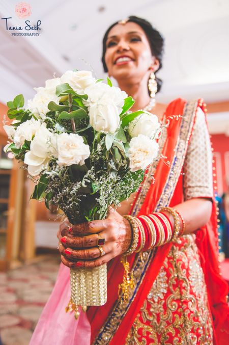 Photo of Bride wearing White Floral Bouquet