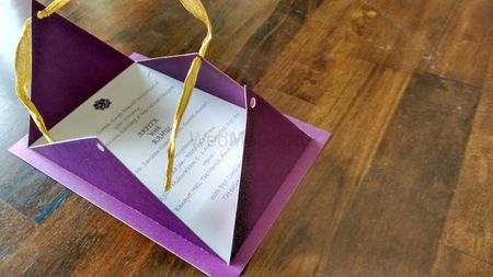 purple invitations with open flap