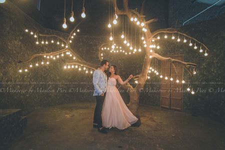 Pre-Wedding Shot Under Hanging Bulbs