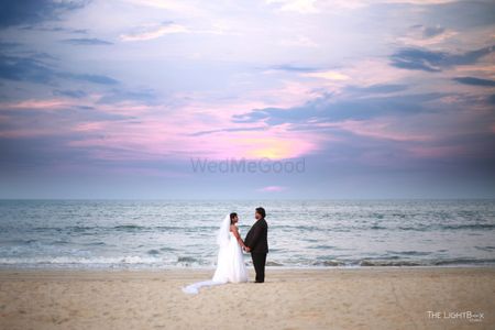 Christian couple on beach during sunset