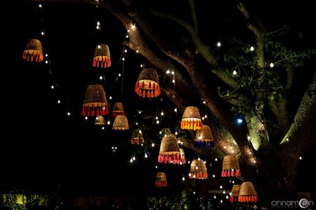 Tree decorations done with upturned baskets, tassels and bulbs.