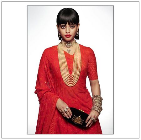 Photo of Red Heritage Bridal Lehenga Complimented with Sabyasachi Heritage Jewellery collection.