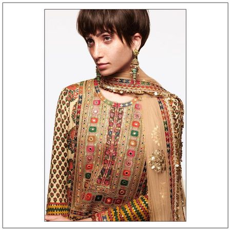 The Neo-Bohemian Modern Mehandi Outfit with Multicolored embroidery.