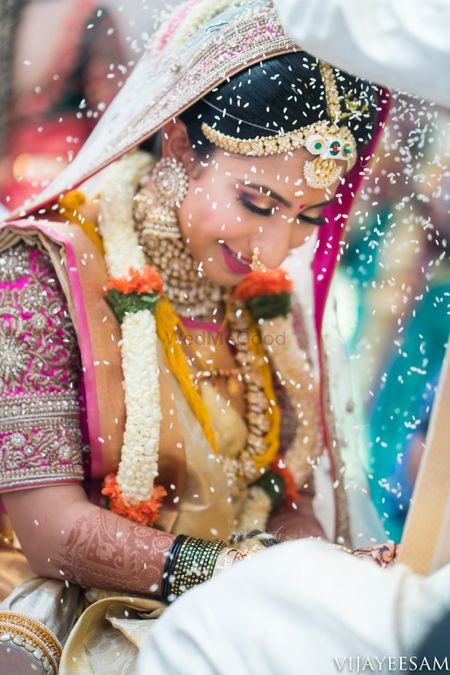 Candid shot of a South Indian bride from her wedding day.