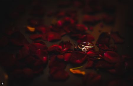 His and Her Engagement Rings with Rose Petals