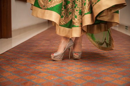 Photo of Silver Bridal Shoes with Green and Gold Lehenga