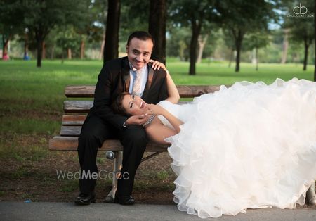 Christian Wedding Couple on Bench with Ruffled Gown