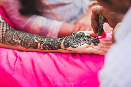Traditional Bold Bridal Mehendi Design on Hand and Arm