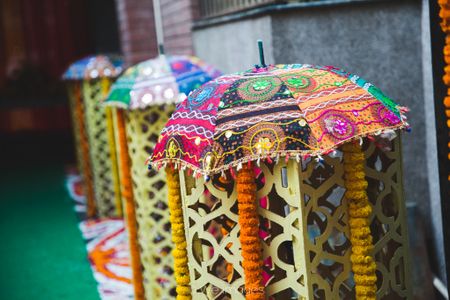 Photo of Colourful Thread Work Umbrellas in Mehendi Decor