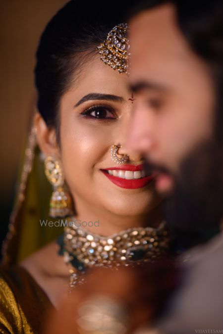 Photo Of South Indian Couple In Colour Coordinated Outfits On Their Wedding Day