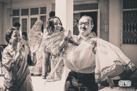 Fun Photo with Father Picking Bride in his Arms