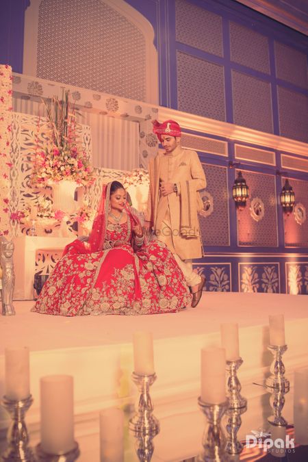 Bride Wearing Bright Red Flared Lehenga on Stage