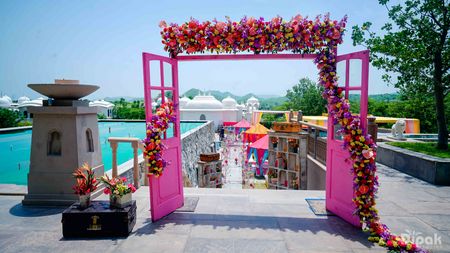 Pink Door with Florals and Vintage Suitcase