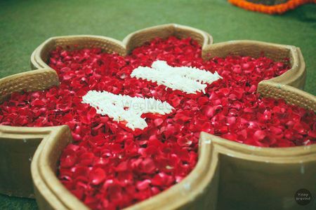 Photo of Monograms with floating petals for entrance decor