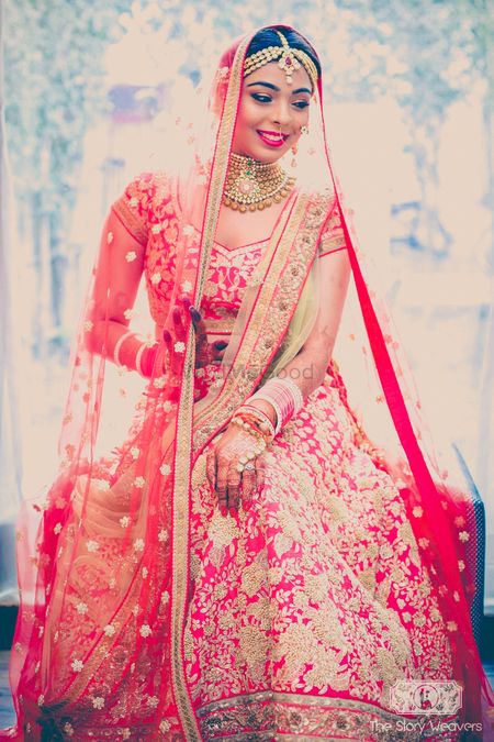 Red bridal lehenga with gold thread work