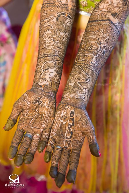 Bridal Mehendi with Rajasthani Couple Portraits Design