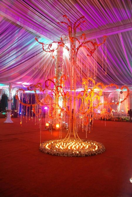 Photo of Unique wedding prop with decorated metal tree