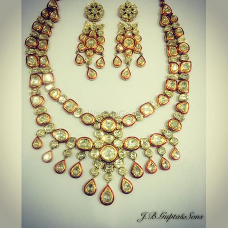 Photo of bridal necklace set with red meena and polki