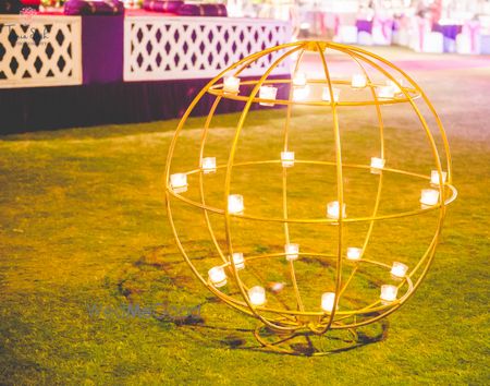 Photo of Yellow Metal Ball Decor Element with Tea Lights