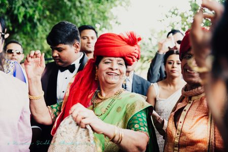 Grandma with Red Turban Dancing in Baraat