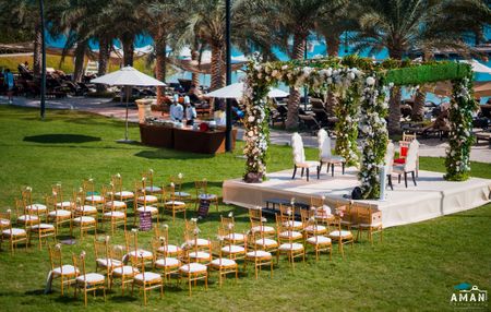 minimal intimate wedding decor with mandap and chairs