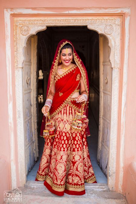 Bride Entering in Bright Red and Gold Bridal Lehenga