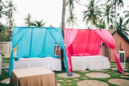 Colourful draped seatings for guests.