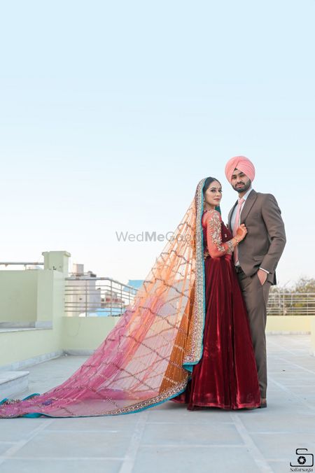 A Sikh couple posing on their engagement ceremony
