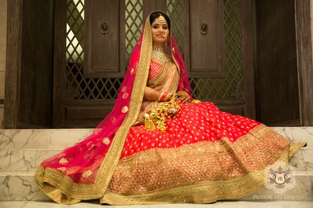 Photo of Bright Pink and Gold Bridal Lehenga with Sequin Work